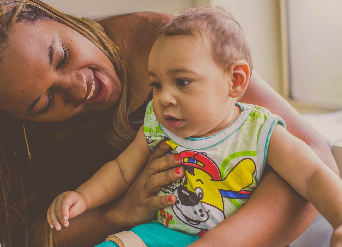 Germana plays with her 8-month old boy, Guilherme. 