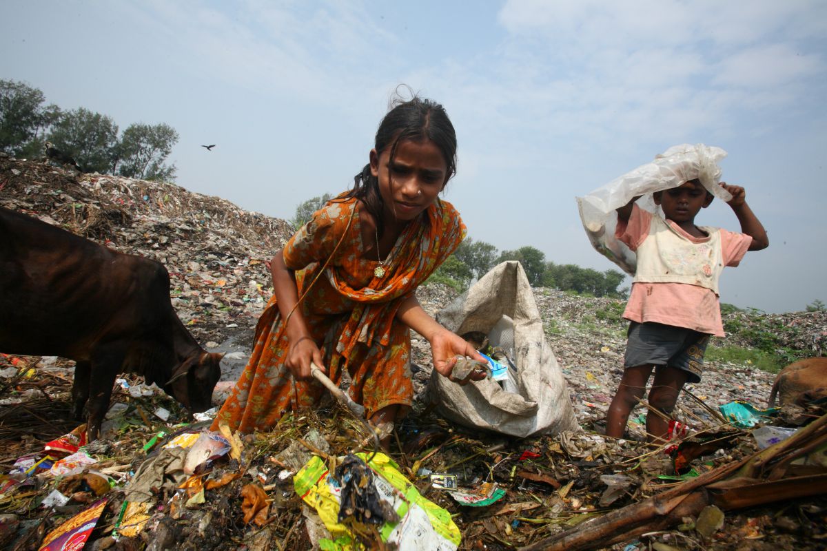 Children sort through rubbish