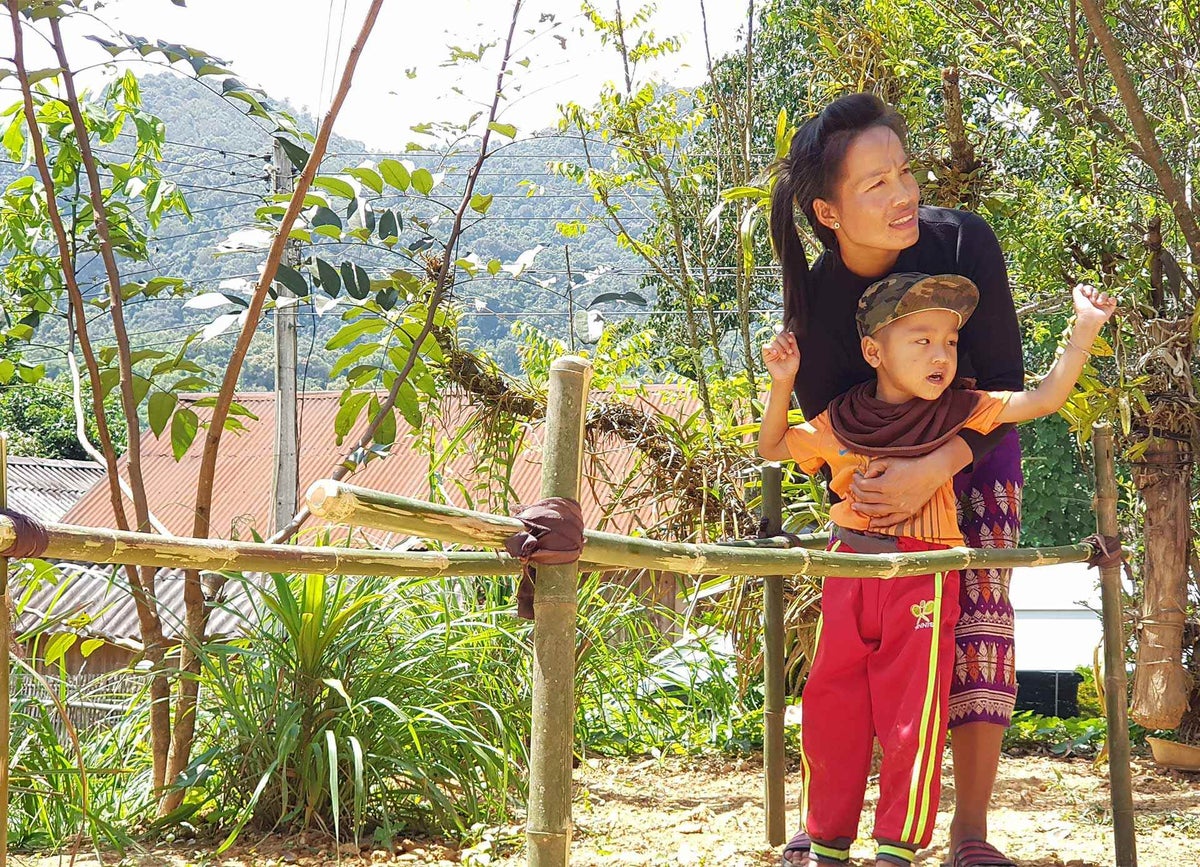 With support from UNICEF, Nang and her son Kum – who has a physical disability – has access to rehabilitation services and advice for the first time.