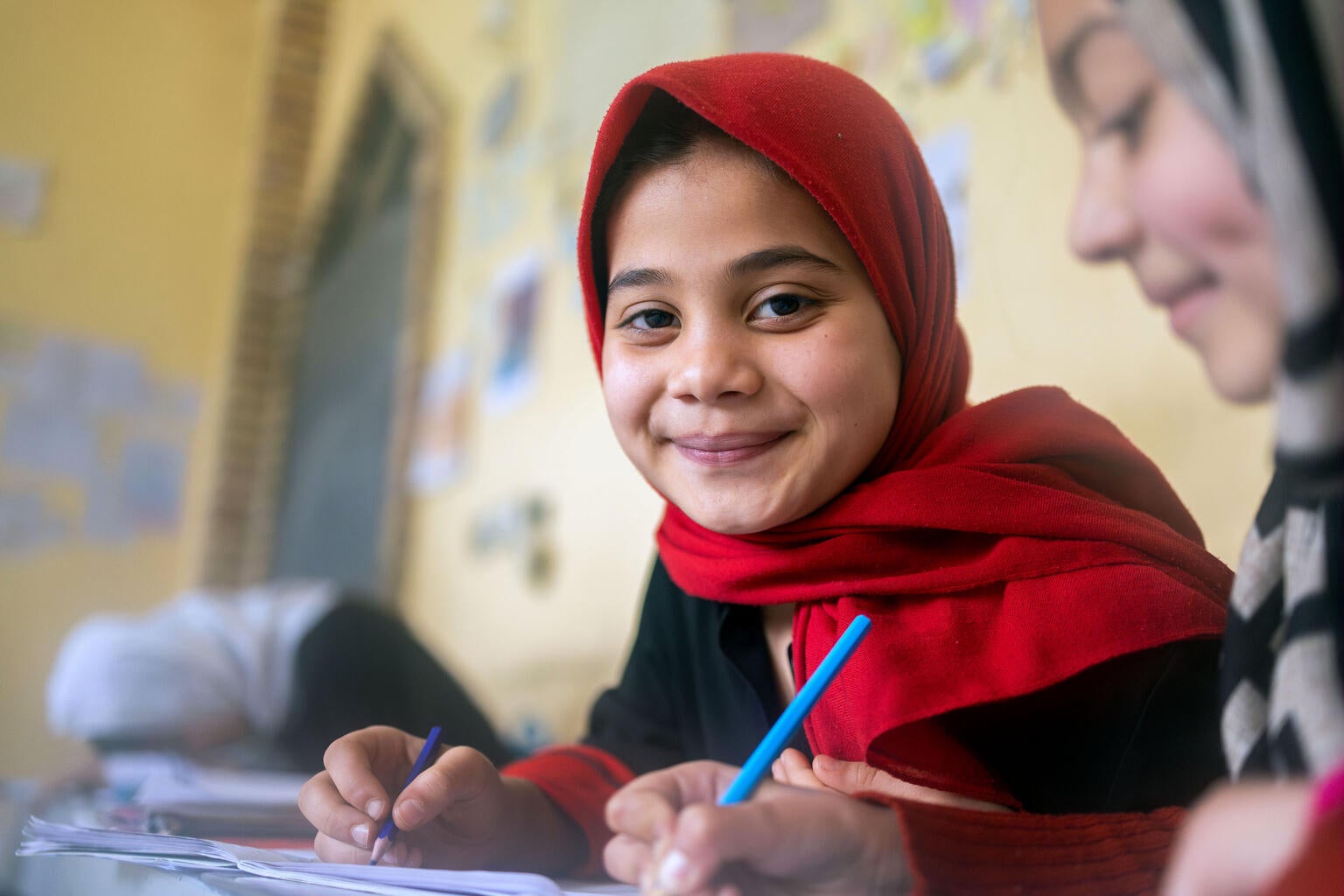 A girl in her classroom in Afghanistan.