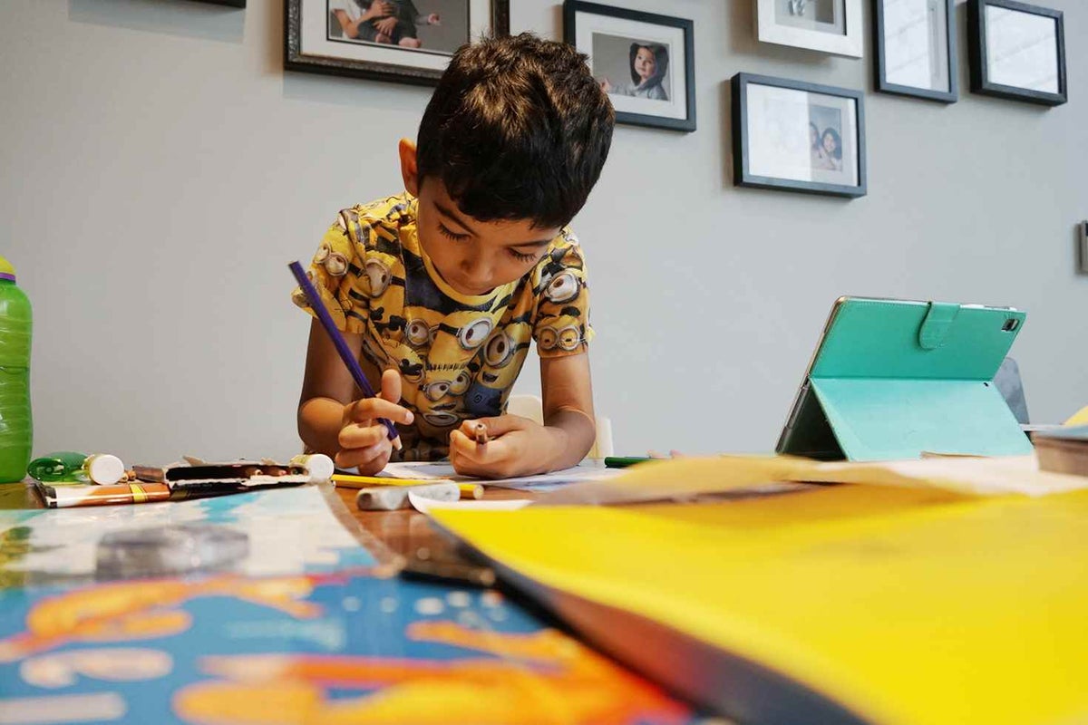 5 year old, Zac, completes a school exercise at home