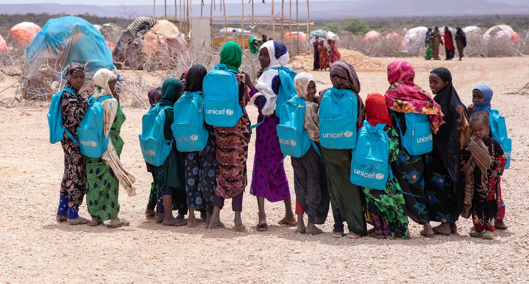A group of school children in Ethiopia wearing donated UNICEF branded school bags. 