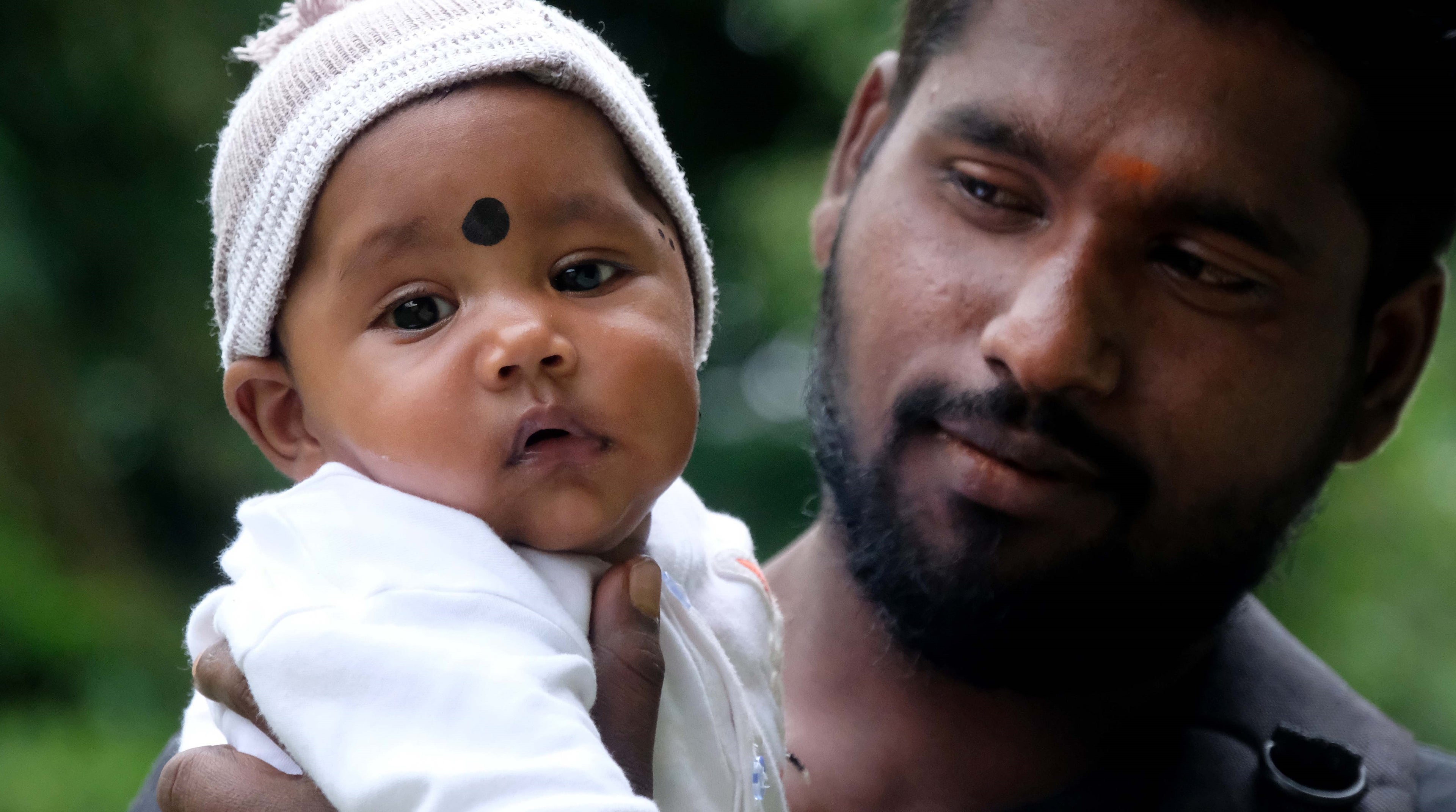 Father holding his child in Sri Lanka 