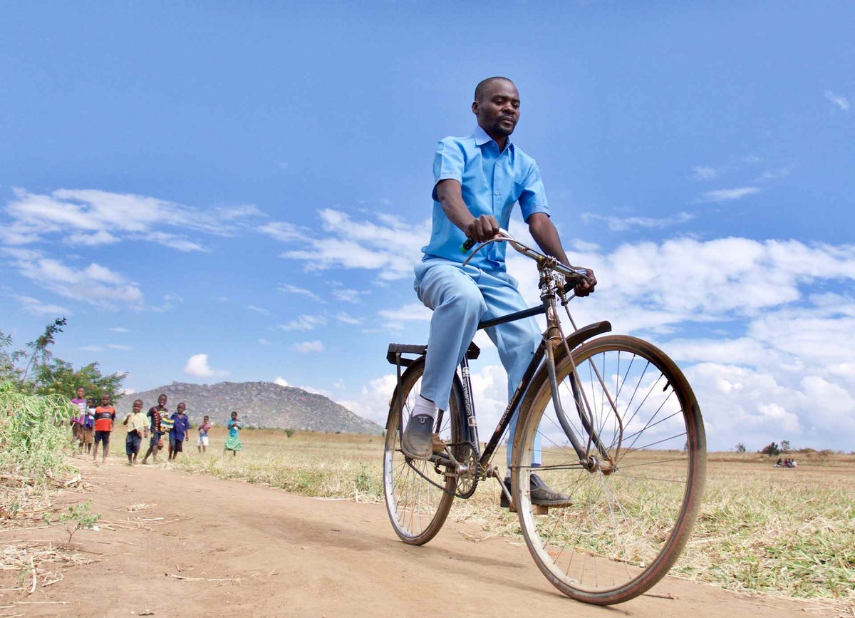 Health Surveillance Assistant, Noah Chipeta, rides his bicycle from the Chanthunthu community clinic to the nearest health centre