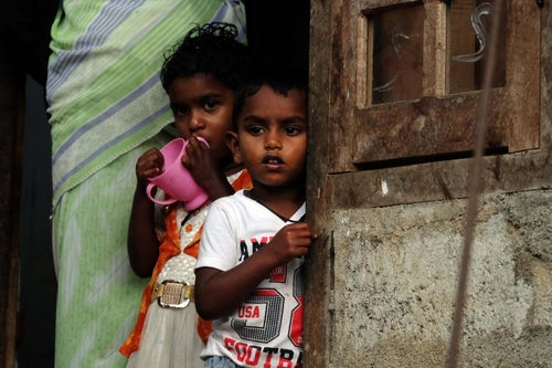 Two children at a doorstep