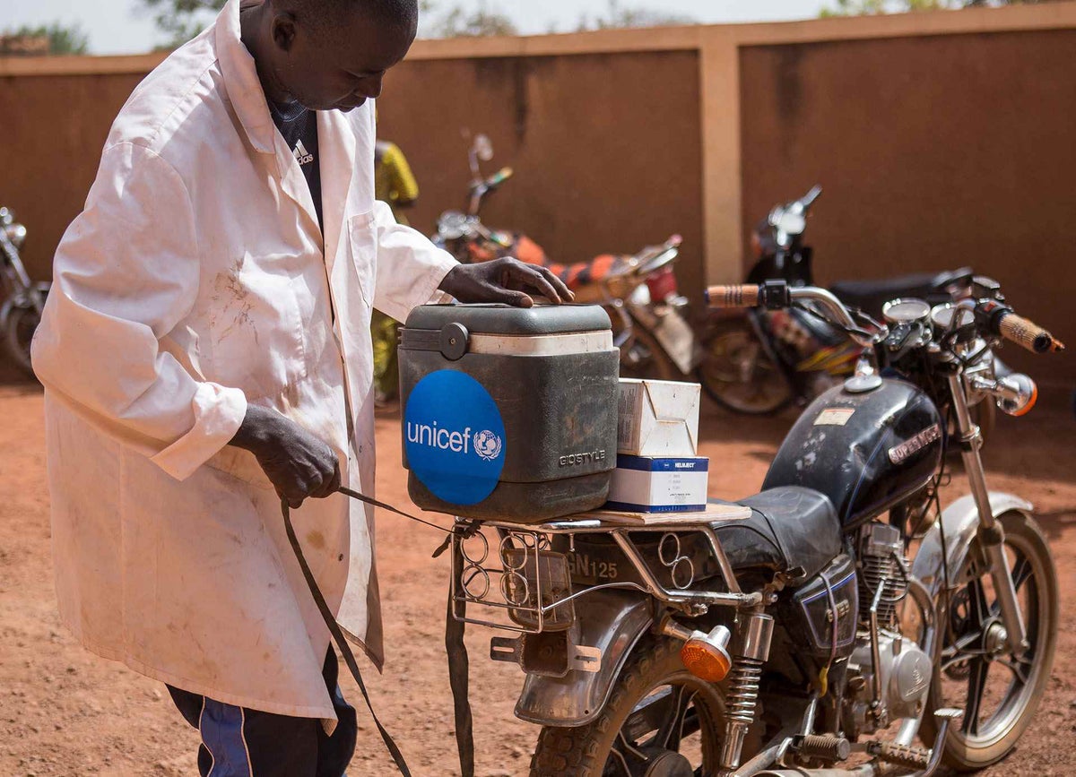 Adama Traoré, 40, has been a vaccinator at Sadiola community health center for more than 10 years. As a mobile vaccinator, he goes to vaccinate children in gold mine sites such as Massakama. 