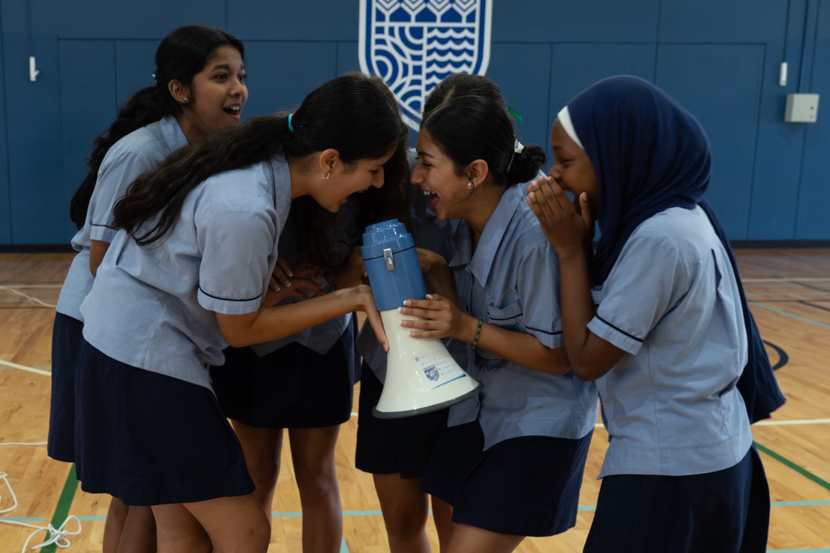 High school girls making some noise for World Children's Day.