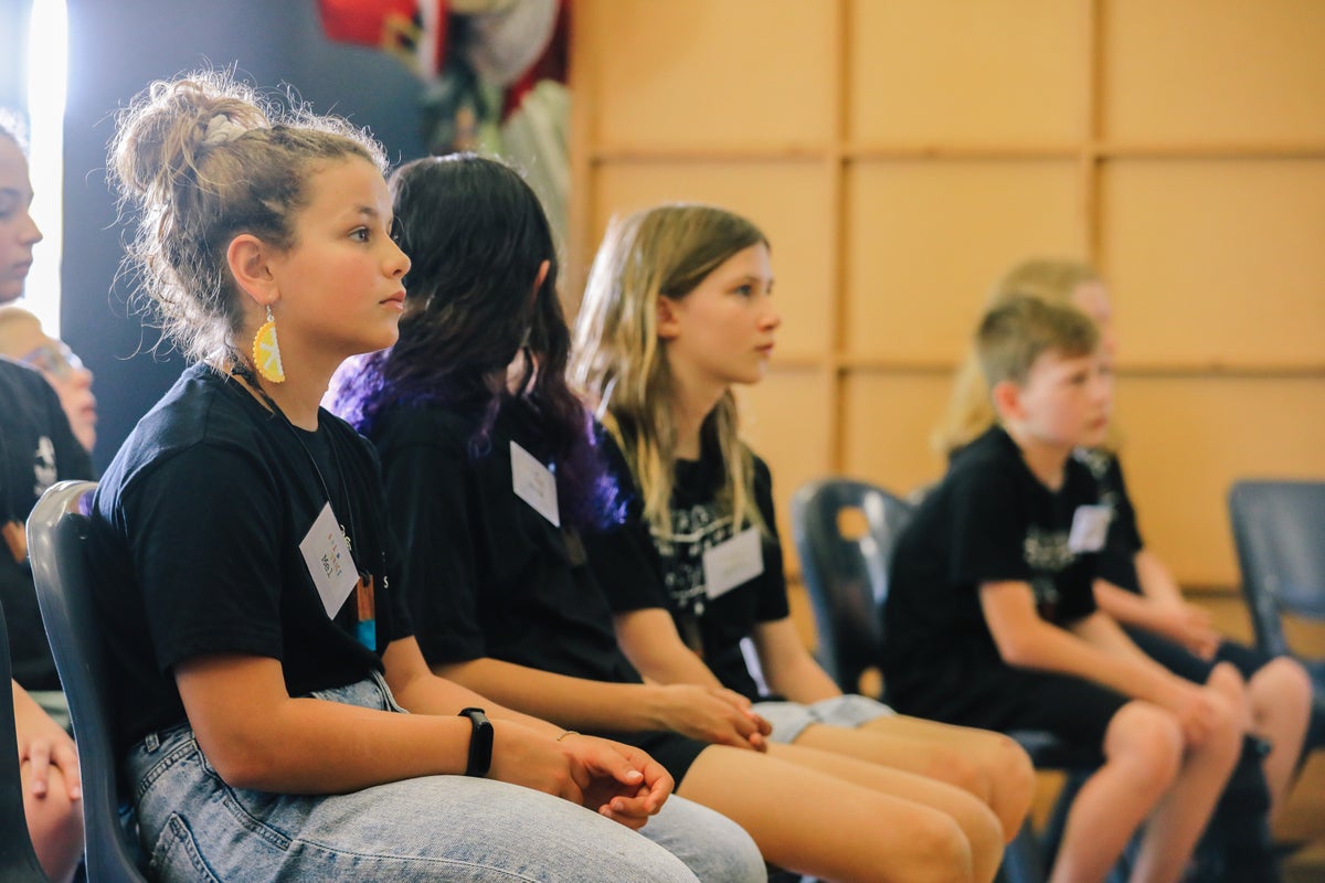 Children sitting and listening.