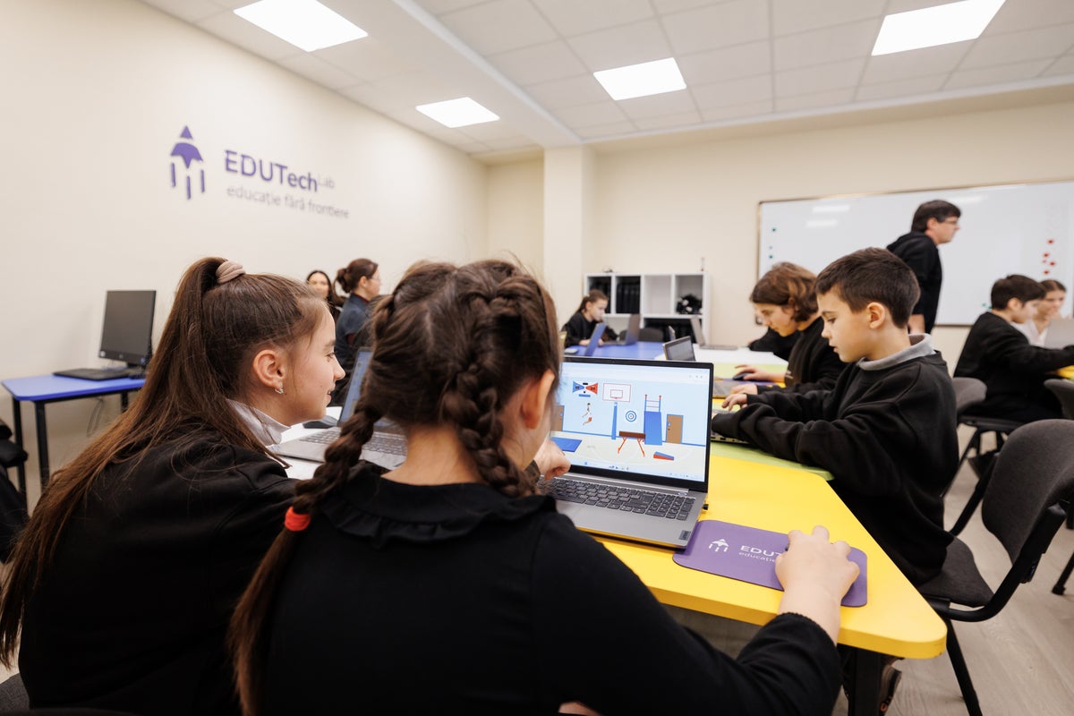 A group of students using laptops. 