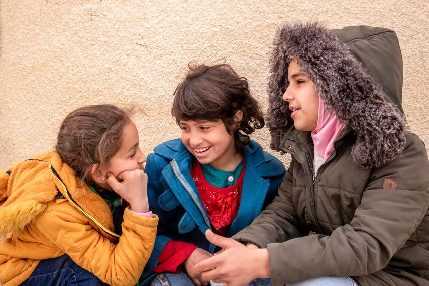 Girls at school in Syria, a country the midst of conflict.