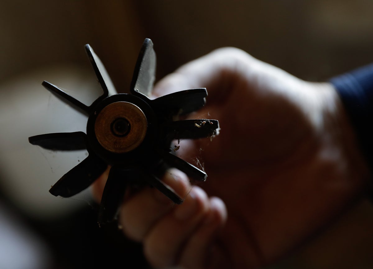 Boy holds the fin from a mortar