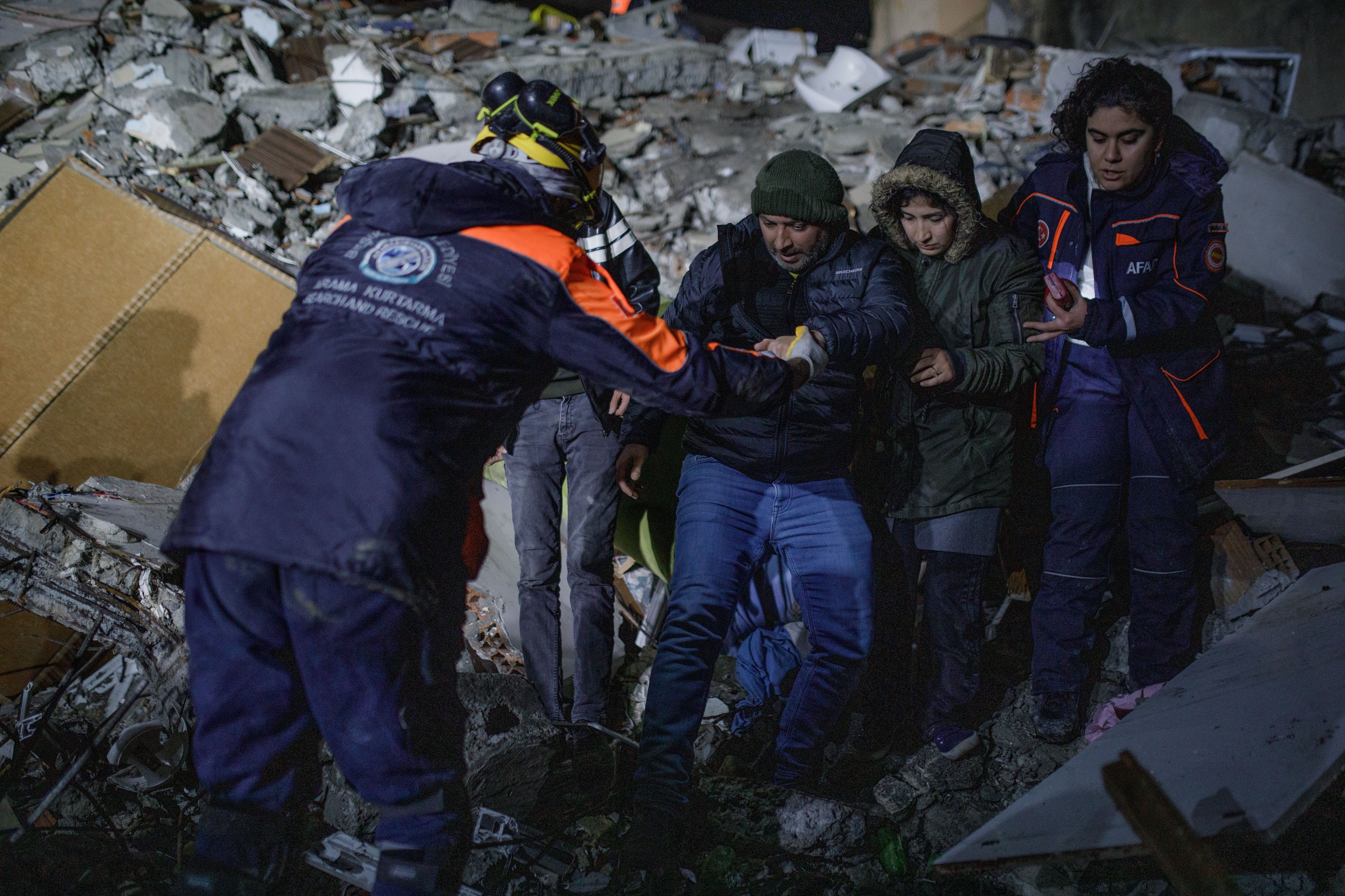 Rescuers scour the debris for survivors following the earthquake in Turkey