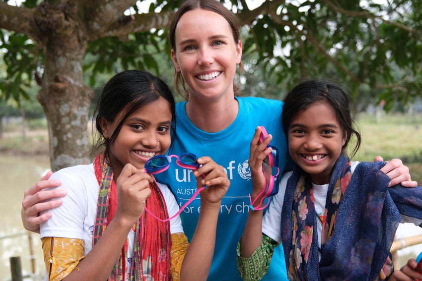 Emma with two young girls.