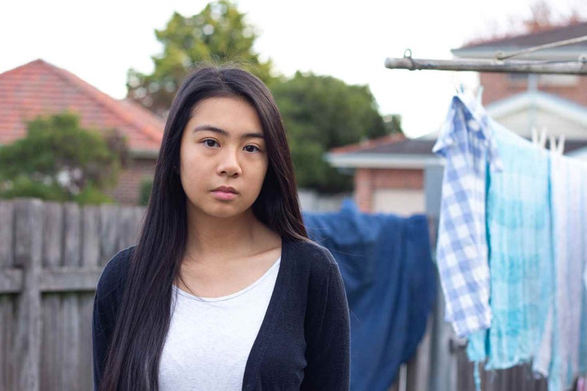 A young girl staring at the camera