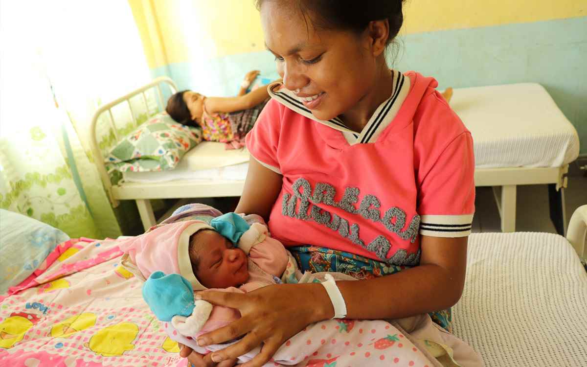 Mum Natalia holds her newborn baby boy Socrates who is just six hours old in this photo, at a UNICEF-supported health clinic in Timor-Leste, May 2019. 