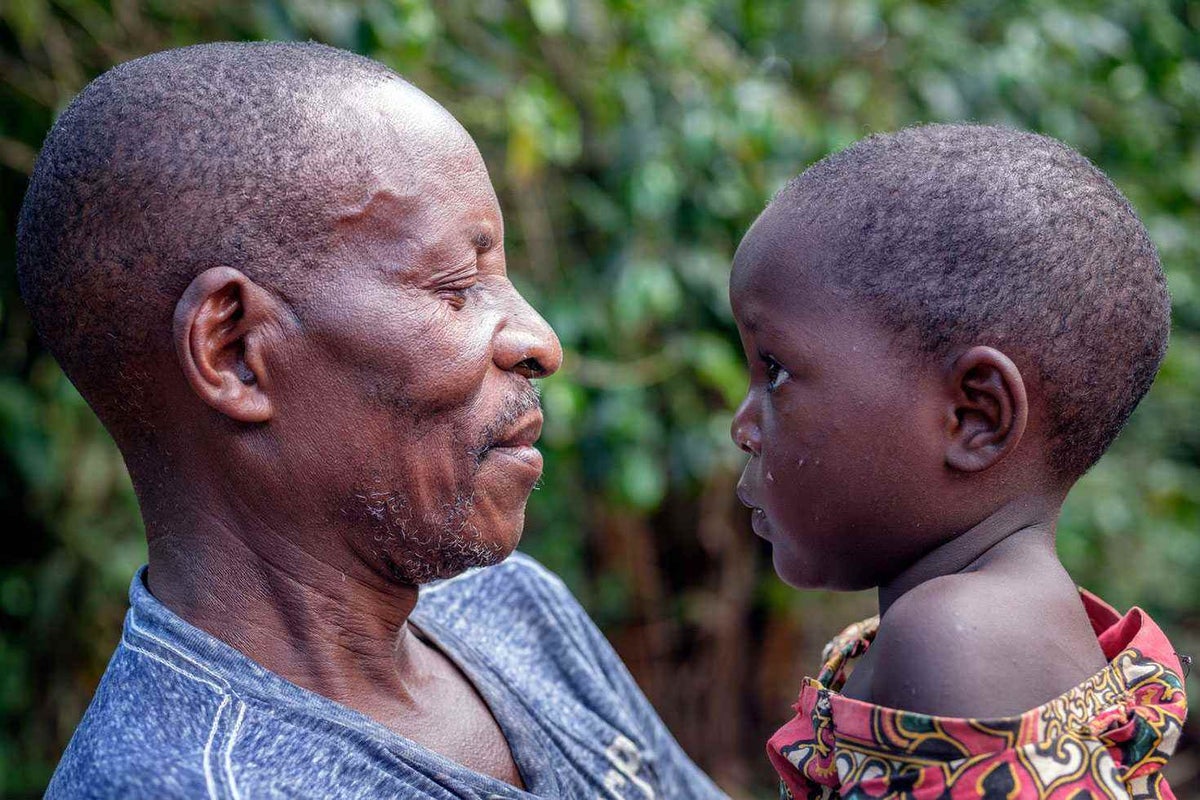 I keep her safe. I wash her school uniform. I take her to the nursery in the morning and I pick her up at 3pm,” says Bwamble, who looks after little Bambu and her siblings while his wife farms.