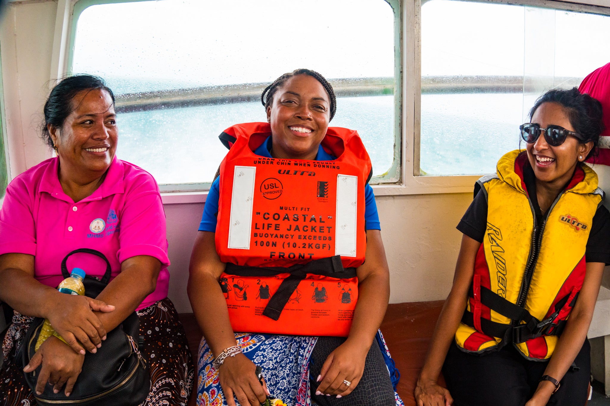 UNICEF, Rotary and Kiribati Ministry of Health staff on a boat, travelling to reach North Tarawa. 