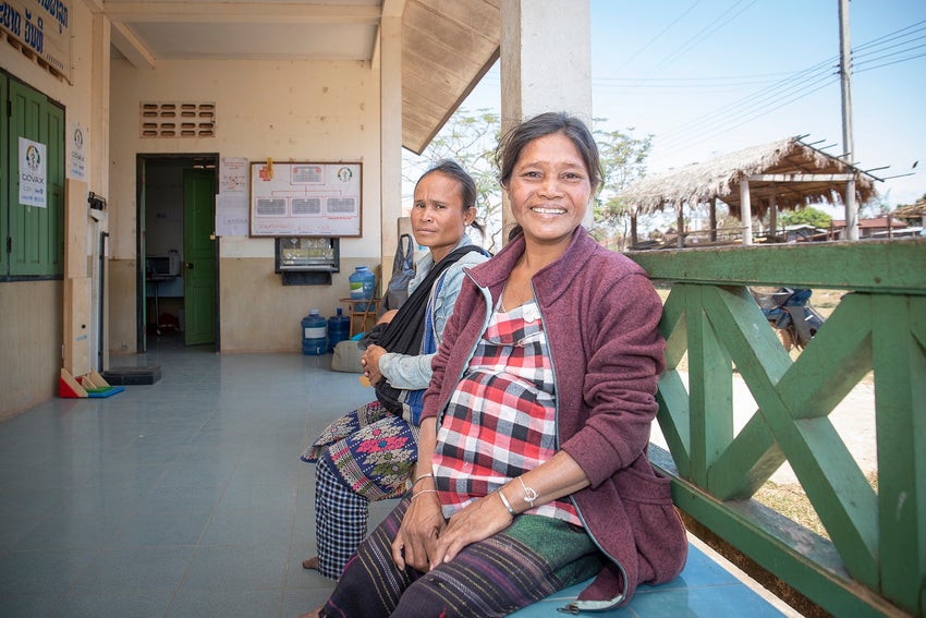 Khao, a pregnant mother sitting outside a health centre in Lao PDR