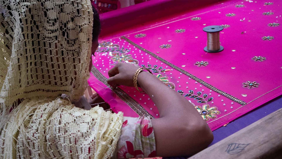 A girl learns embroidery at a UNICEF-supported vocational centre. 
