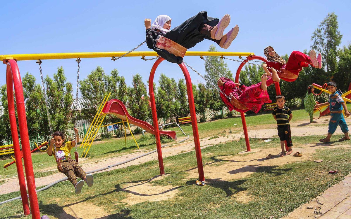 Displaced children play at a UNICEF-supported child-friendly space in Haydariyah in Najaf, Iraq in May 2016. 