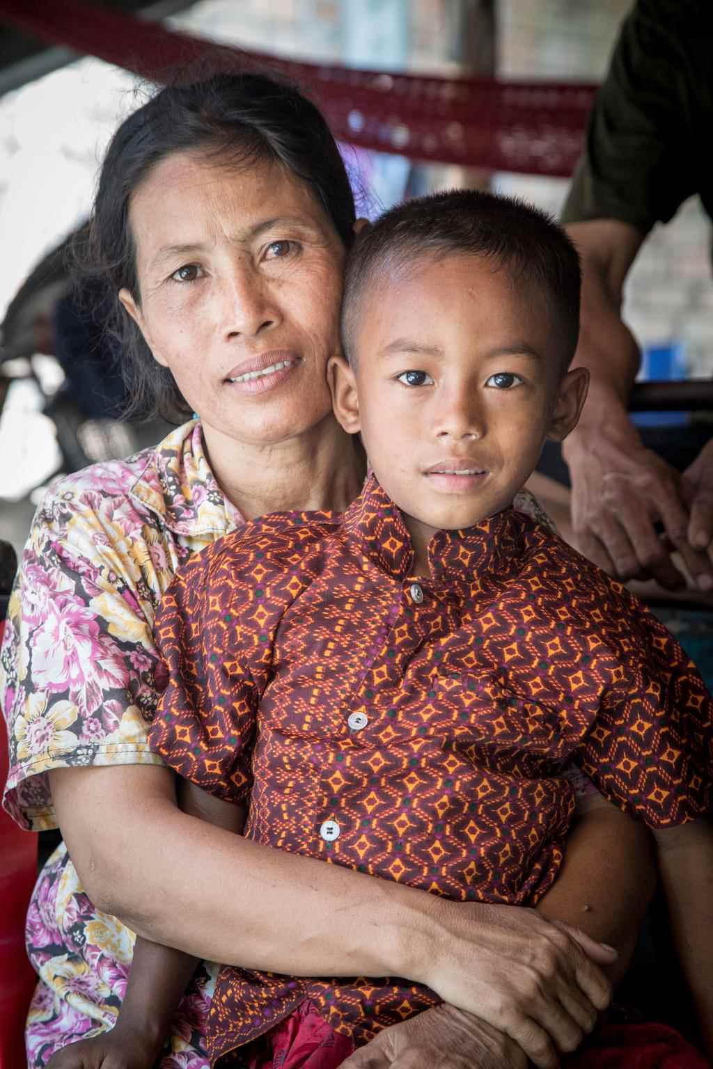  Sareth sits with her son Chamroen in an urban settlement in Cambodia in 2014. 