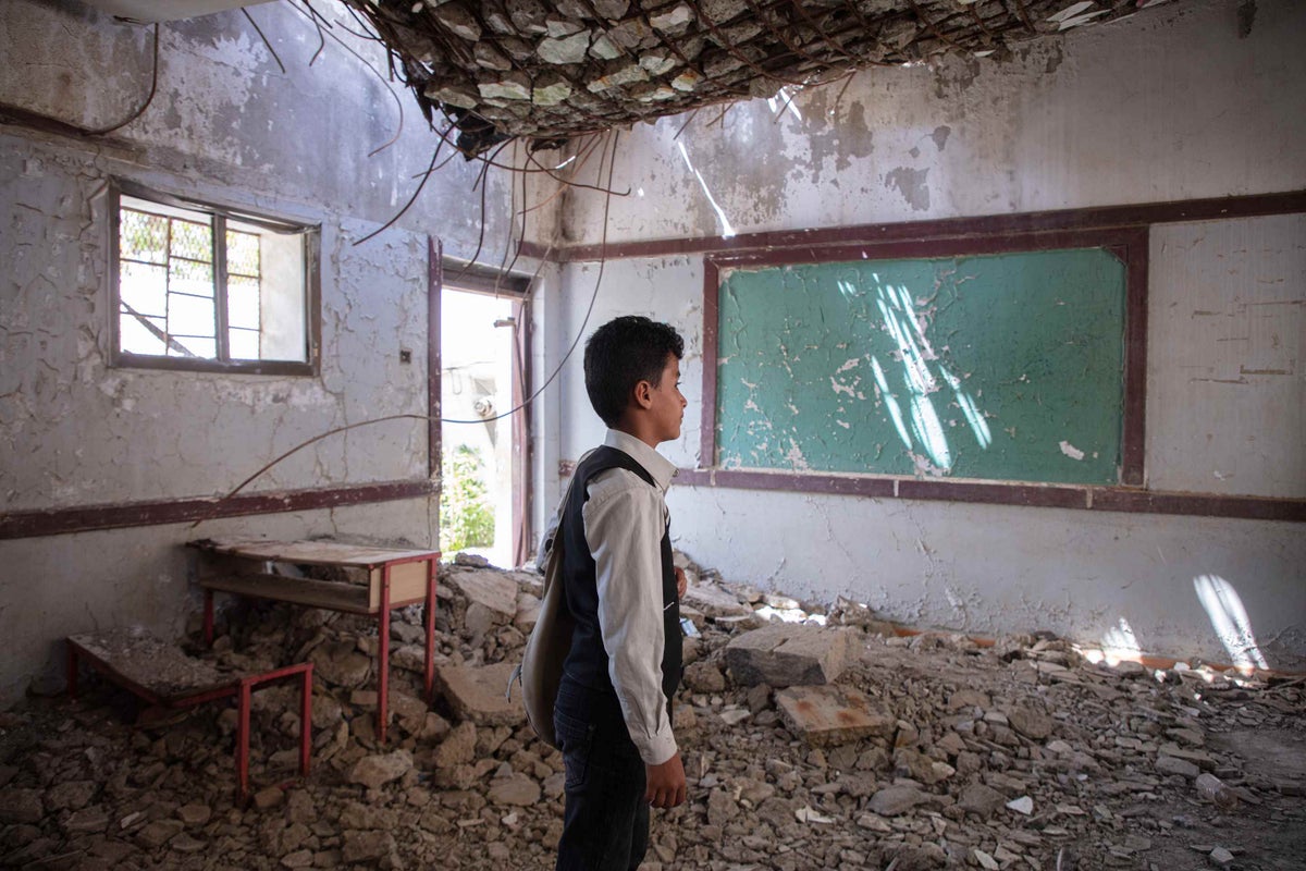 12-year-old Ahmed inside one of the damaged classes in Yemen. 