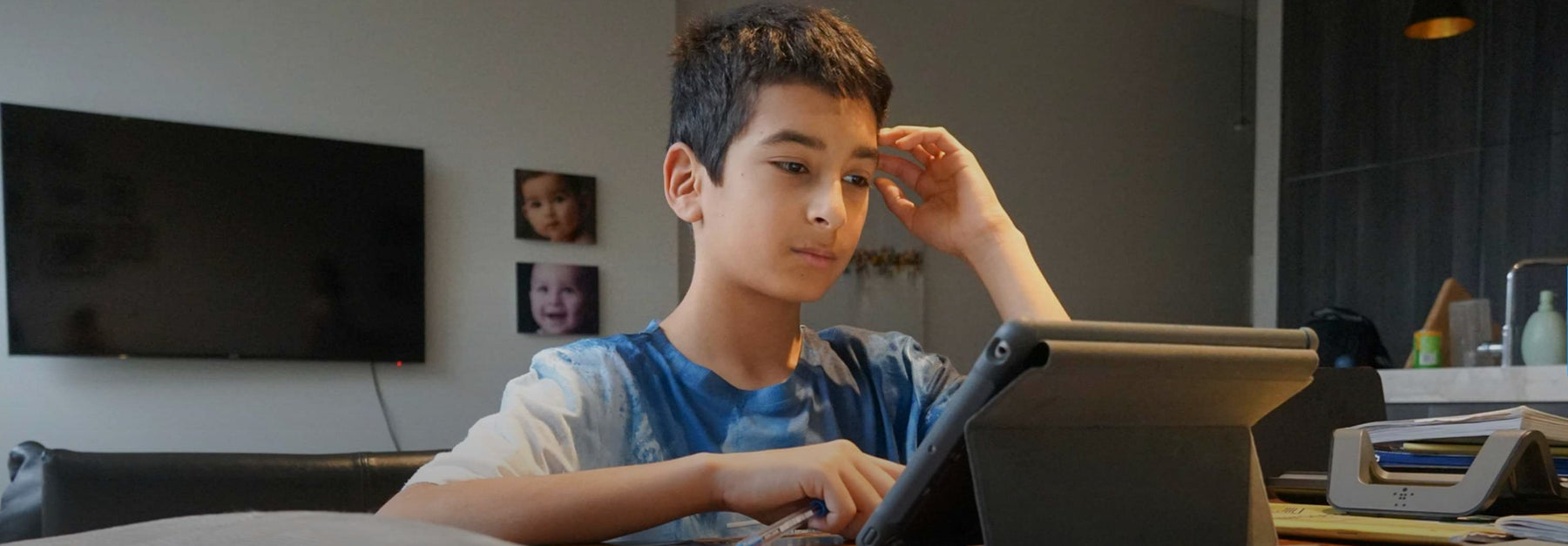 A boy looking at a computer screen