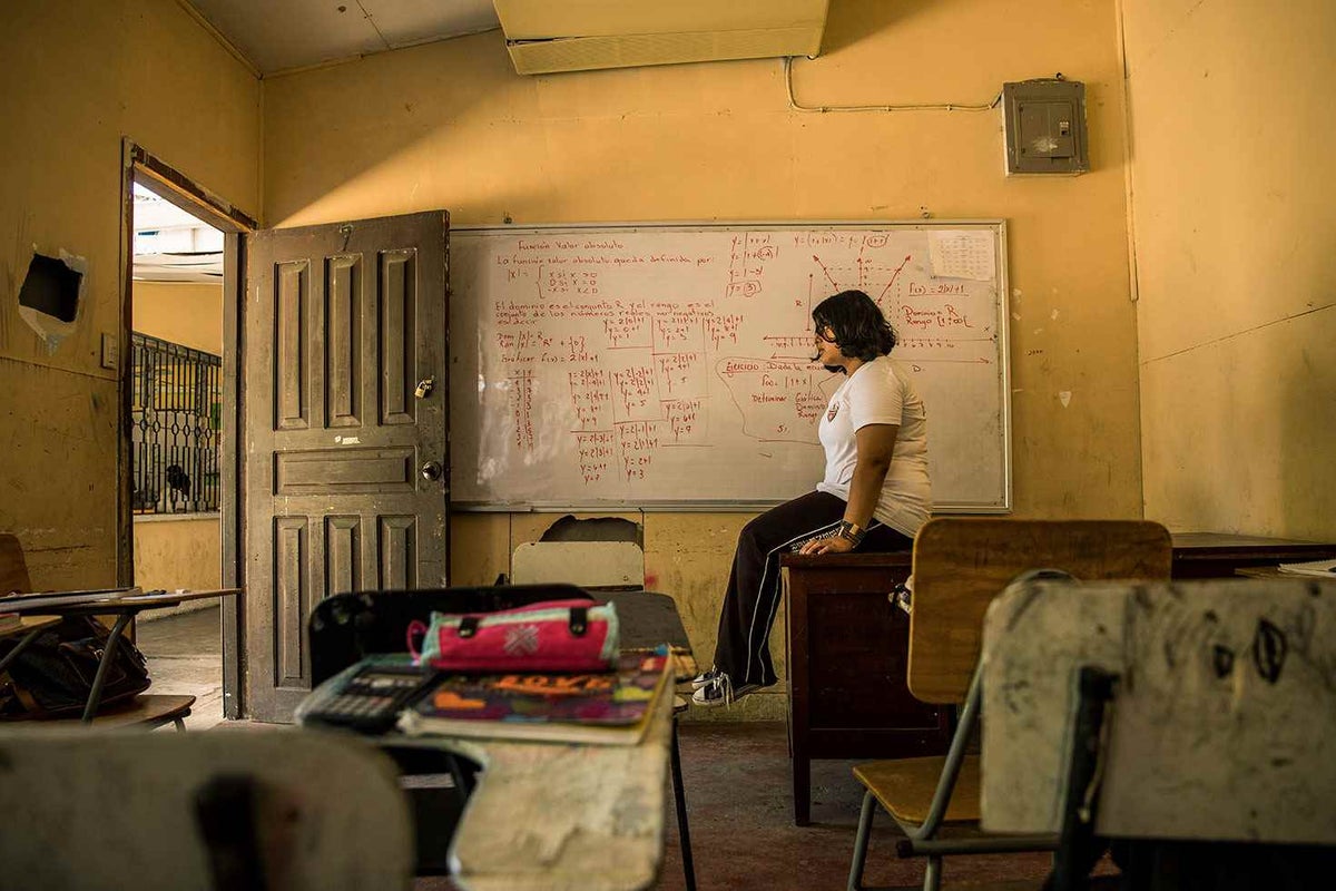 Geraldine, 16, sits in her classroom. She suffered from repeated bullying.