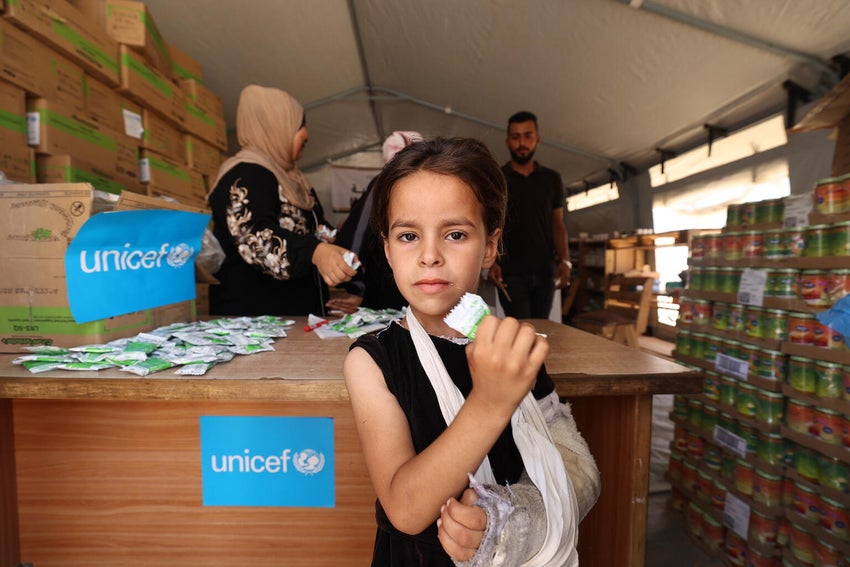 Children receive nutrition support at a UNICEF-supported malnutrition screening and treatment point in Gaza.