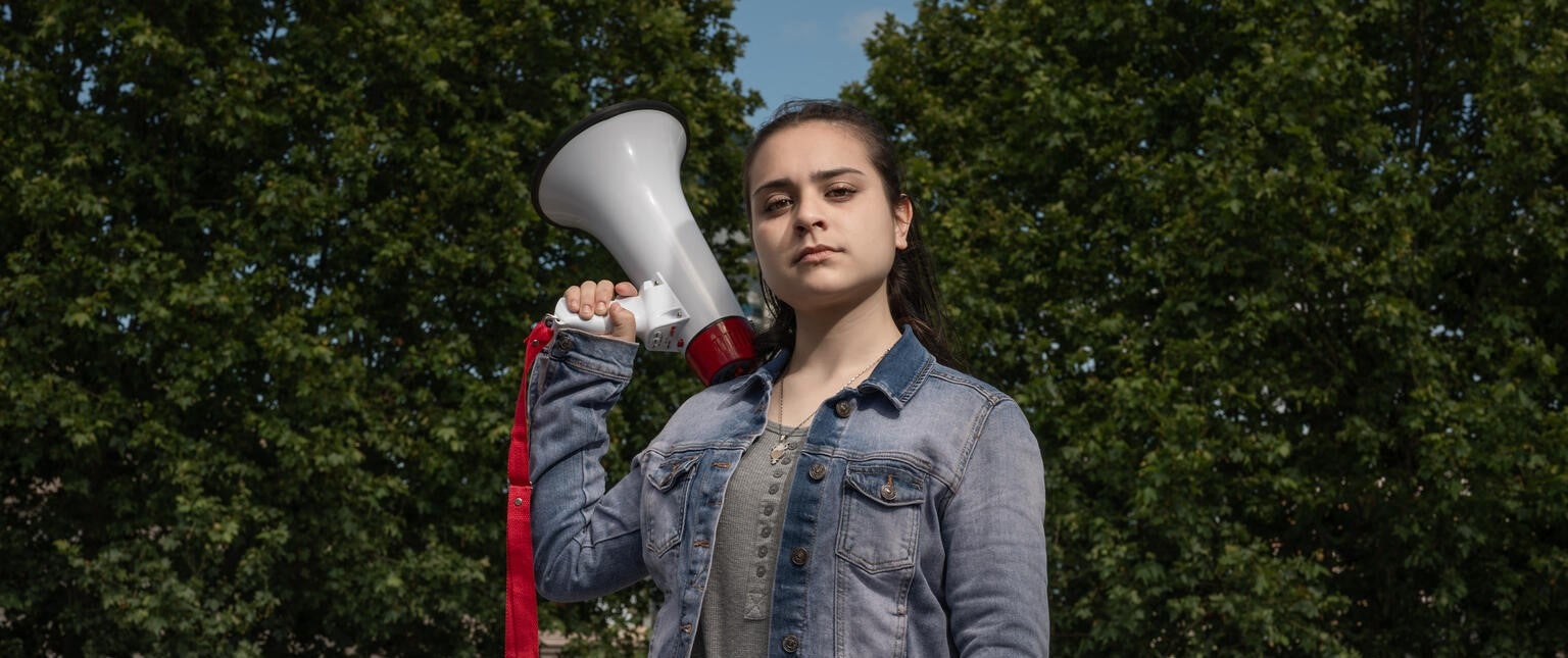 Young girl holding a megaphone 