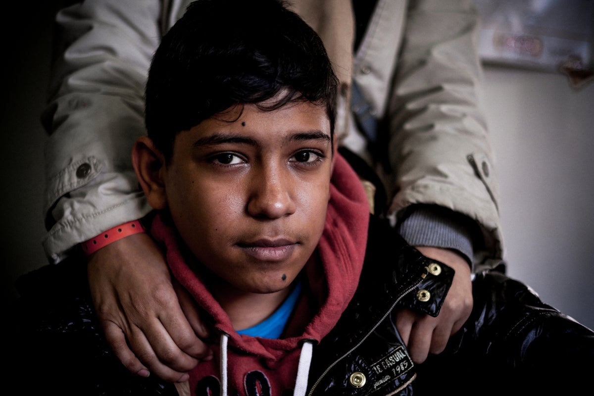 A portrait of a young man looking at the camera