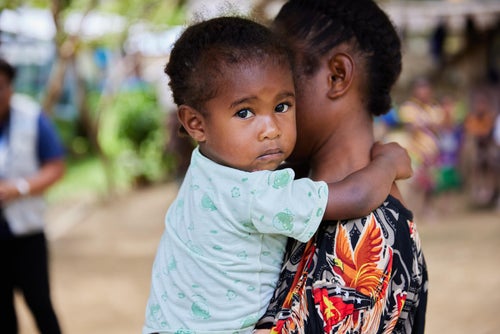 A mother holds her baby daughter in Papua New Guinea.