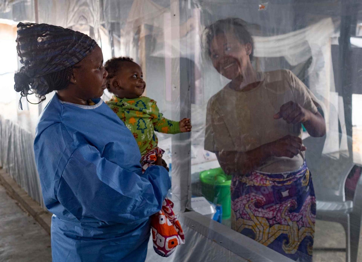 A plastic sheet separates five-month-old Guerrishon from his mother, Collette, who is a patient at an Ebola Treatment Centre in Beni, North Kivu province.