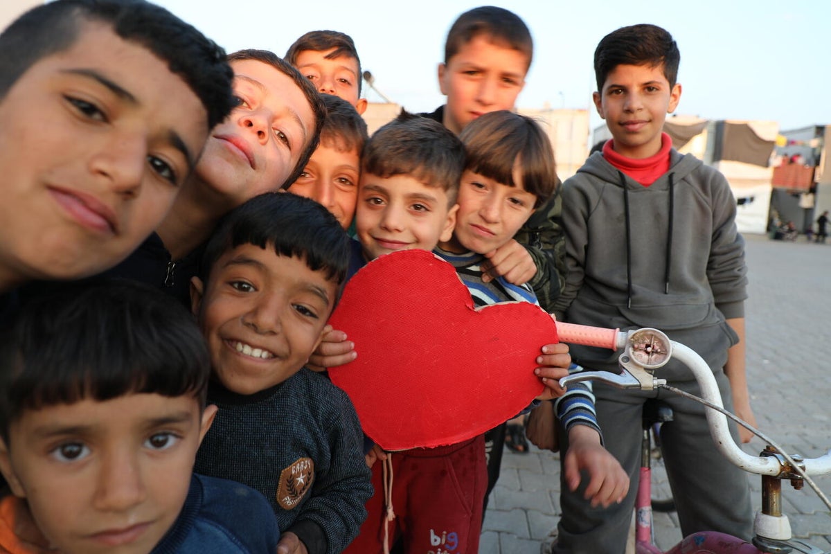 Kids holding a heart cutout in Turkiye