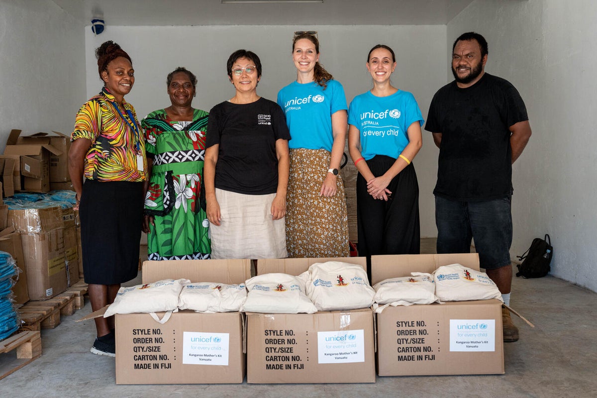 UNICEF Australia and UNICEF Vanuatu teams preparing the items for distribution.  
