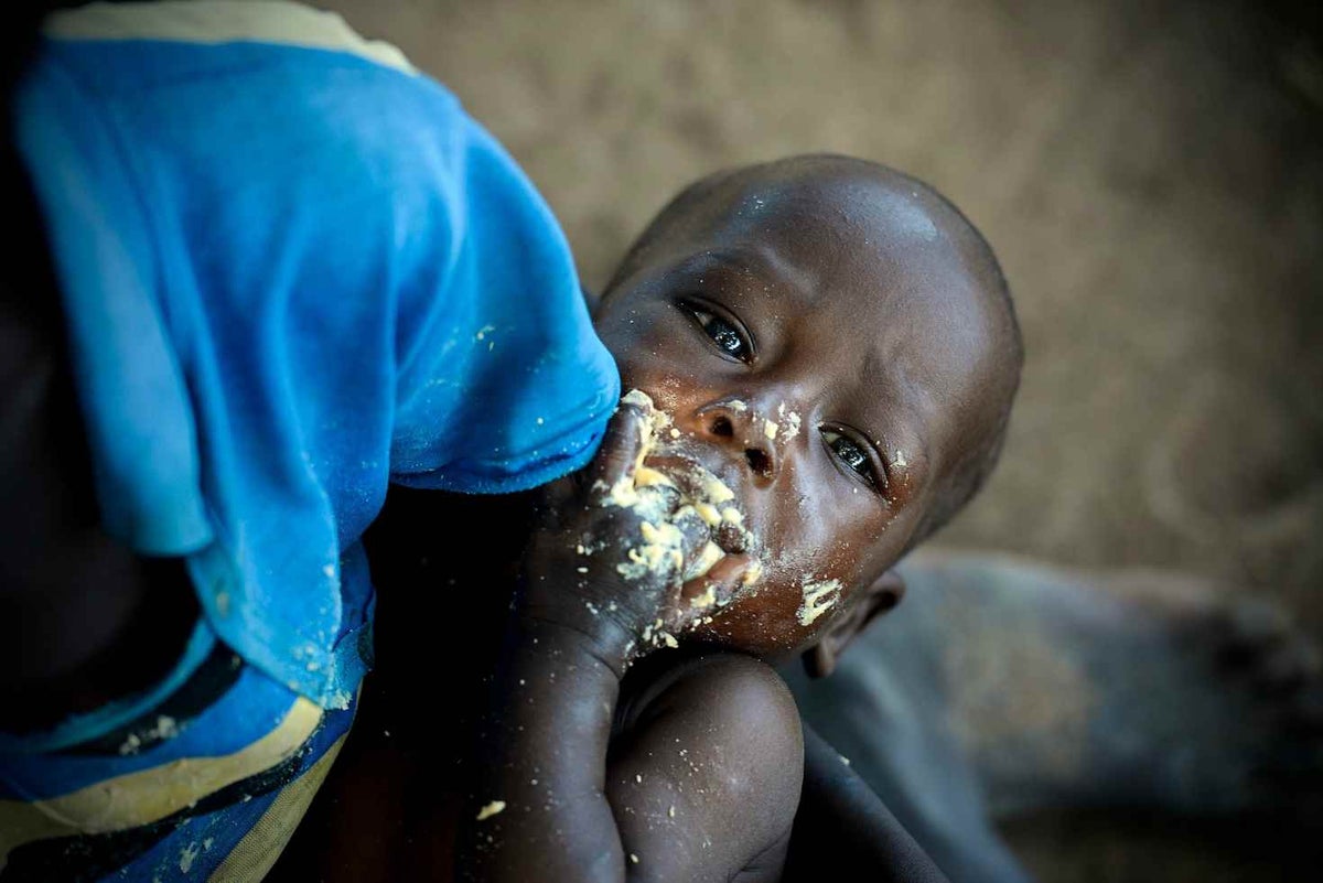 Child eating high-calorie peanut paste