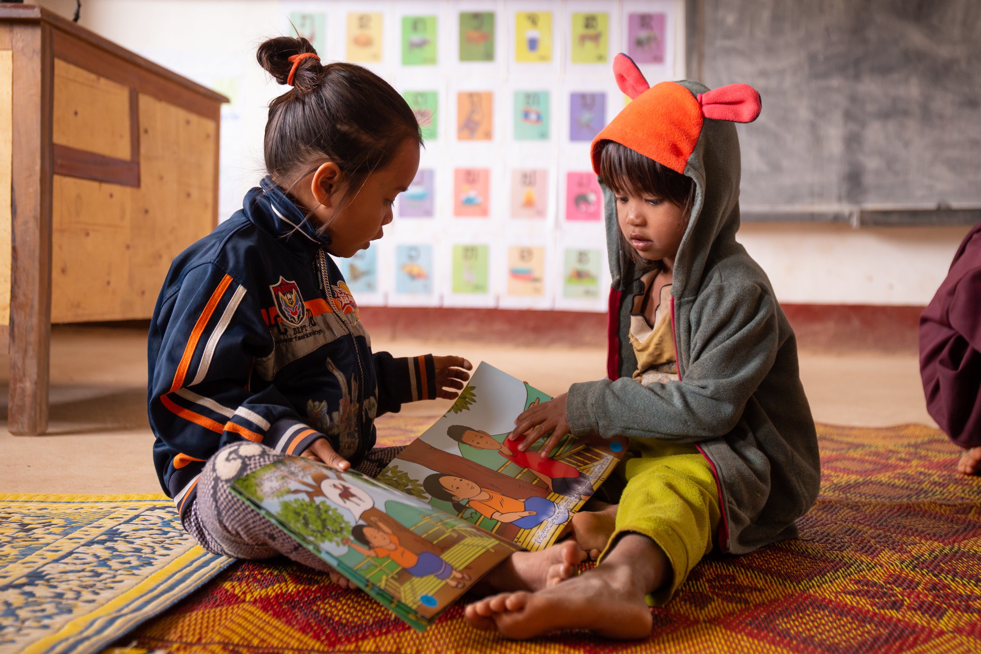 Kids read books in Laos