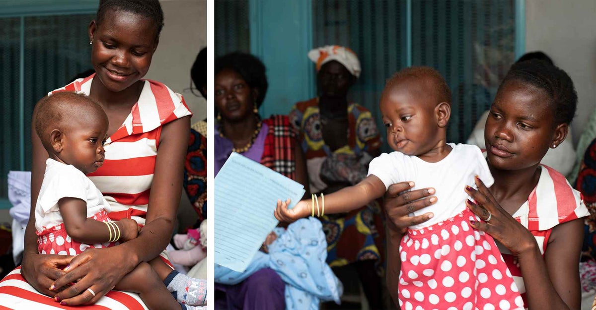 Christine, nine-months-old, plays with her vaccination card outside a health clinic in South Sudan’s capital Juba. 