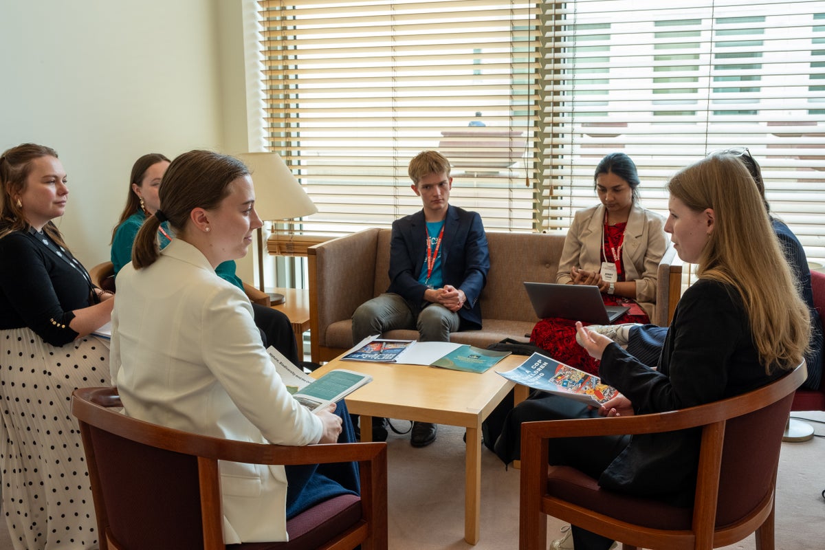 UNICEF Australia Young Ambassador Max (centre) and other youth representatives present Senator Charlotte Walker (second from left) with the National Children and Youth Climate Statement.