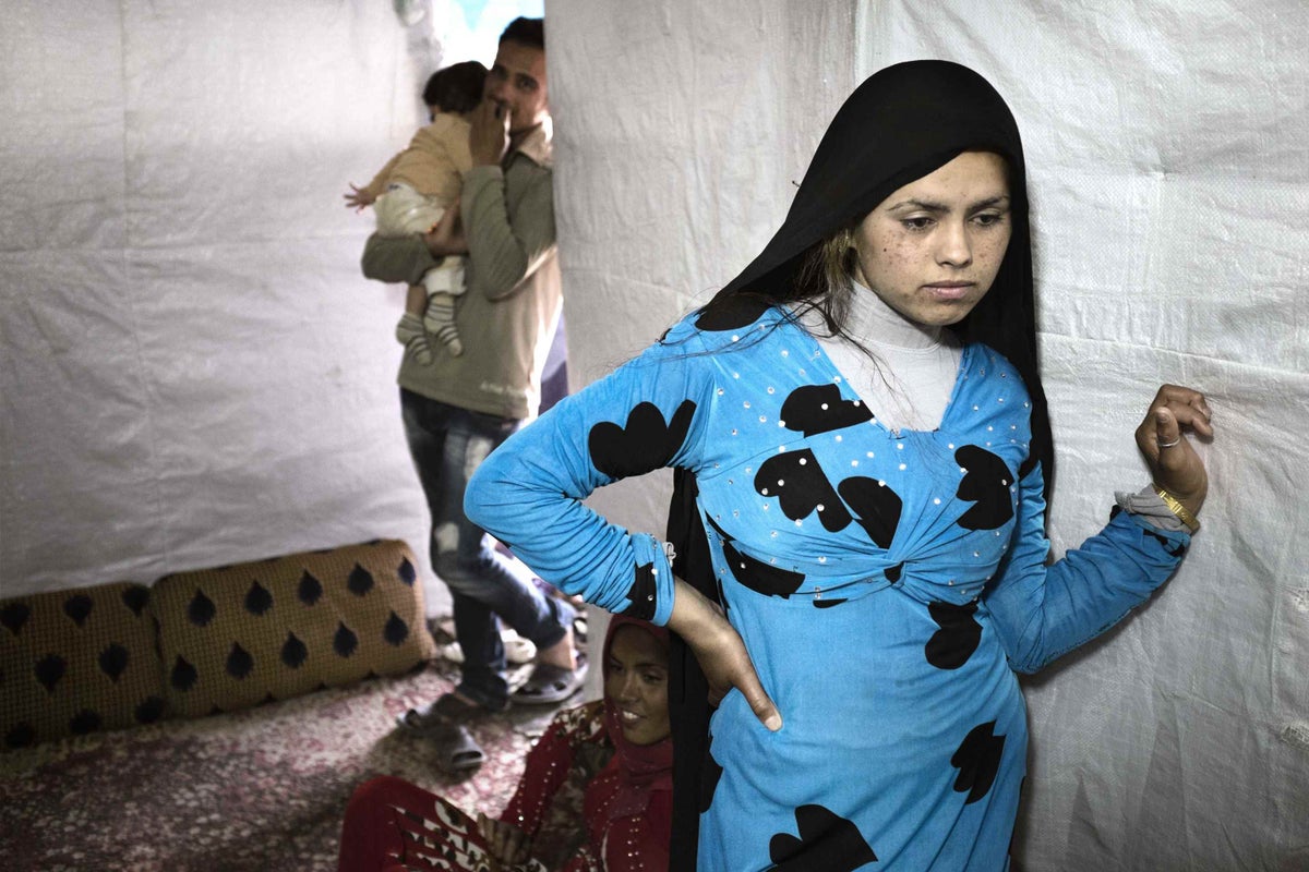 Hened is a 14 year-old Syrian refugee in Lebanon. Her husband died six months after they wed in their homeland. Pregnant at the time, she later miscarried due, she said, to the pain and fear she felt
