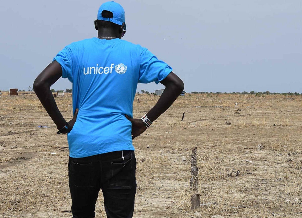 UNICEF field worker exploring what is left of Ogweni School
