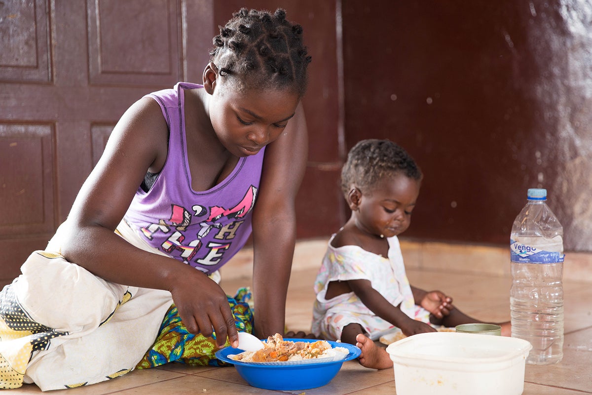 Elizarda and her two children we saved by a helicopter after spending three days on the roof of a shop.