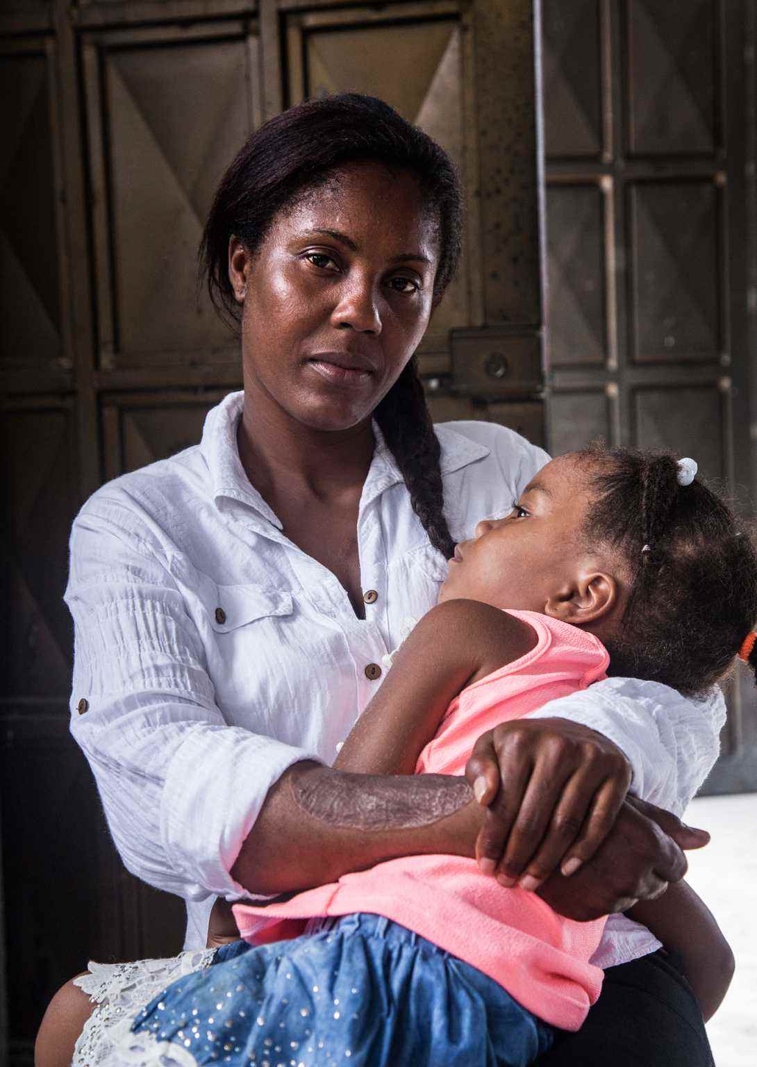 Luz Dari Landázuri holds her daughter after giving a workshop on mine awareness in Narino, Colombia. Luz herself is a victim of a landmine accident.  
