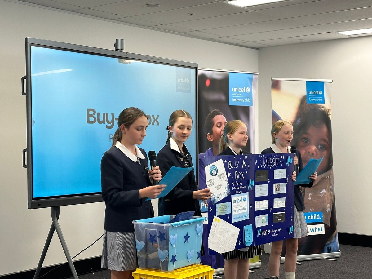 Students presenting their idea to the UNICEF Australia team.