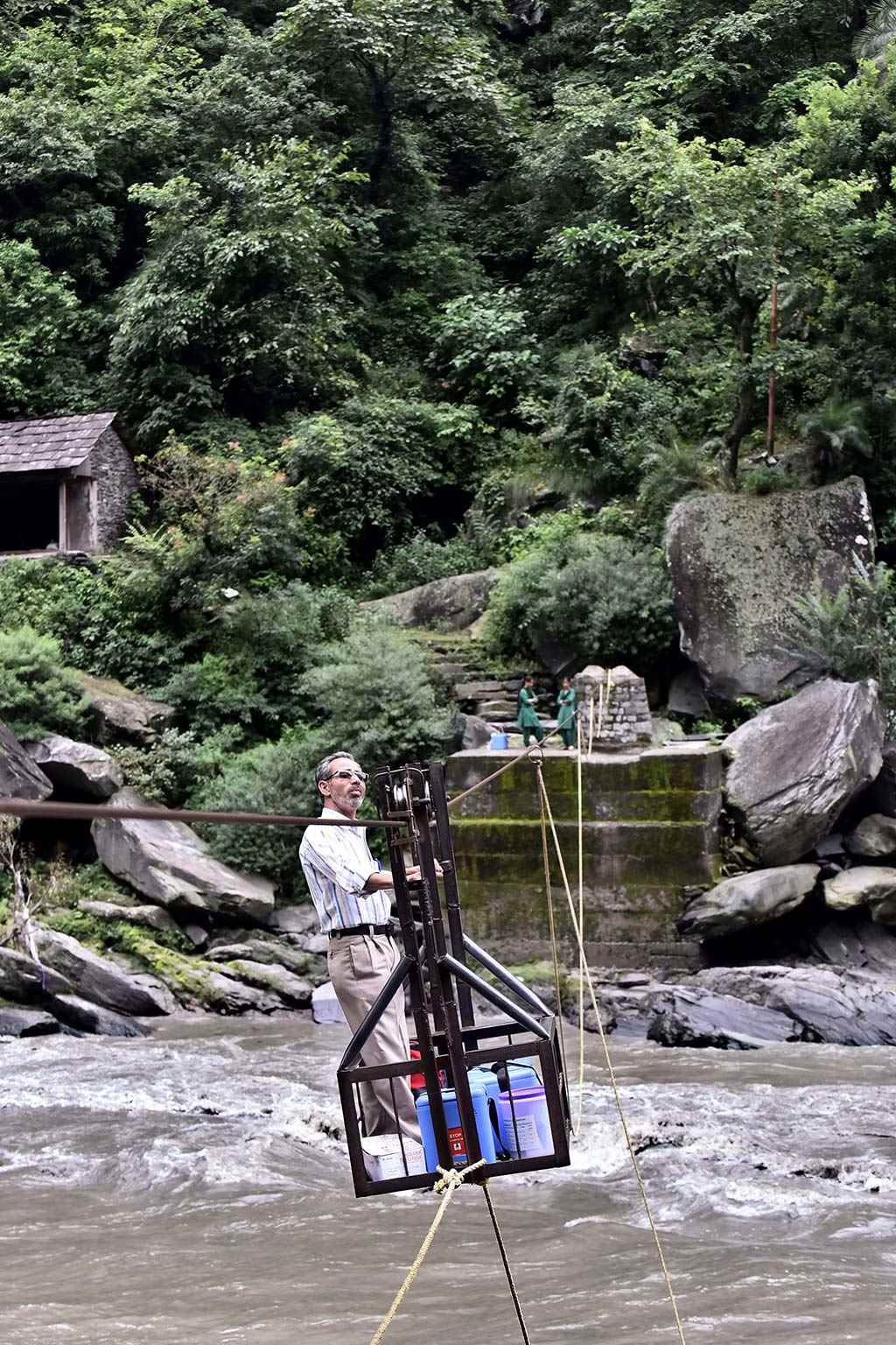 Healthcare worker Dole Singh carries vaccines in a trolley cart across rivers in remote, mountainous regions of India to reach children with measles and rubella vaccinations. 