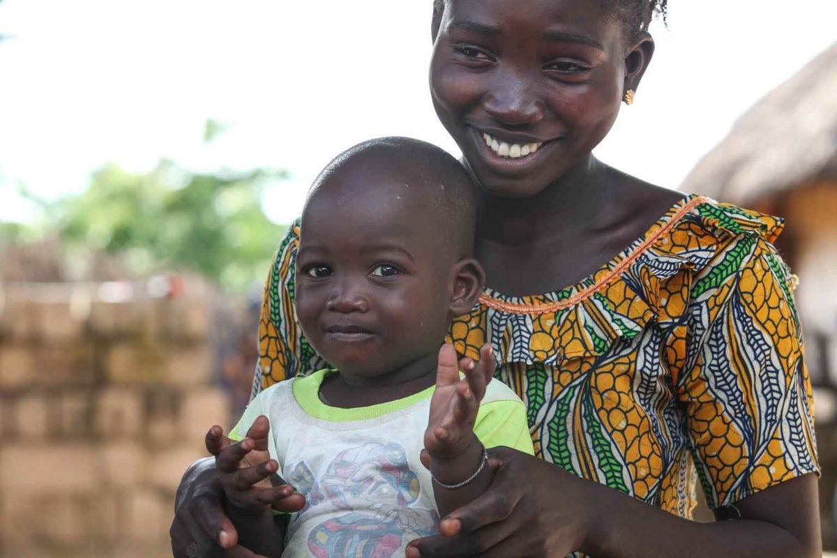 Young mother Ami holds her 18 month-old son in the Nioro province of Senegal in 2013. Ami lost her first baby to neonatal tetanus three years earlier. 