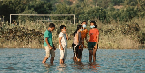 Children playing the water in Timor-Leste