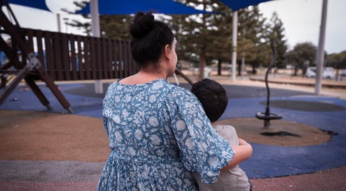 A mother comforts her child