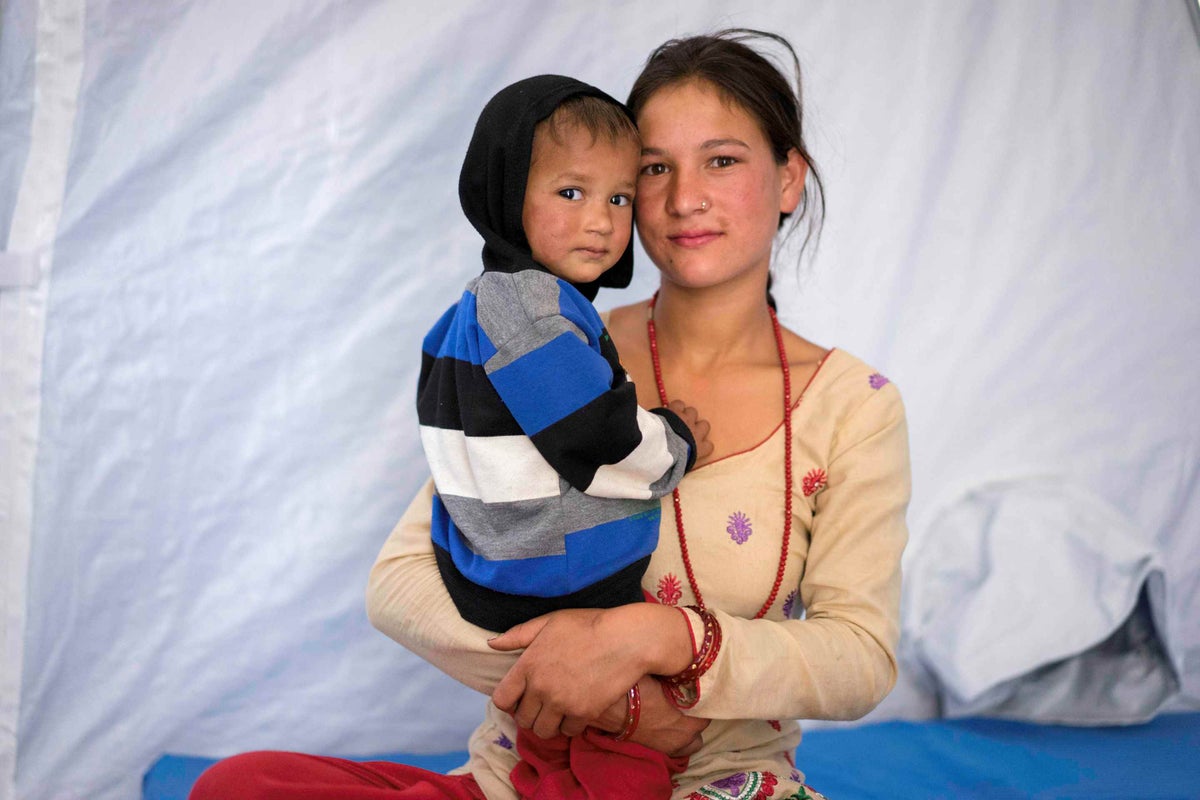 Bimila Dhakune and her son Kris at a hospital in Charikot in Nepal.  