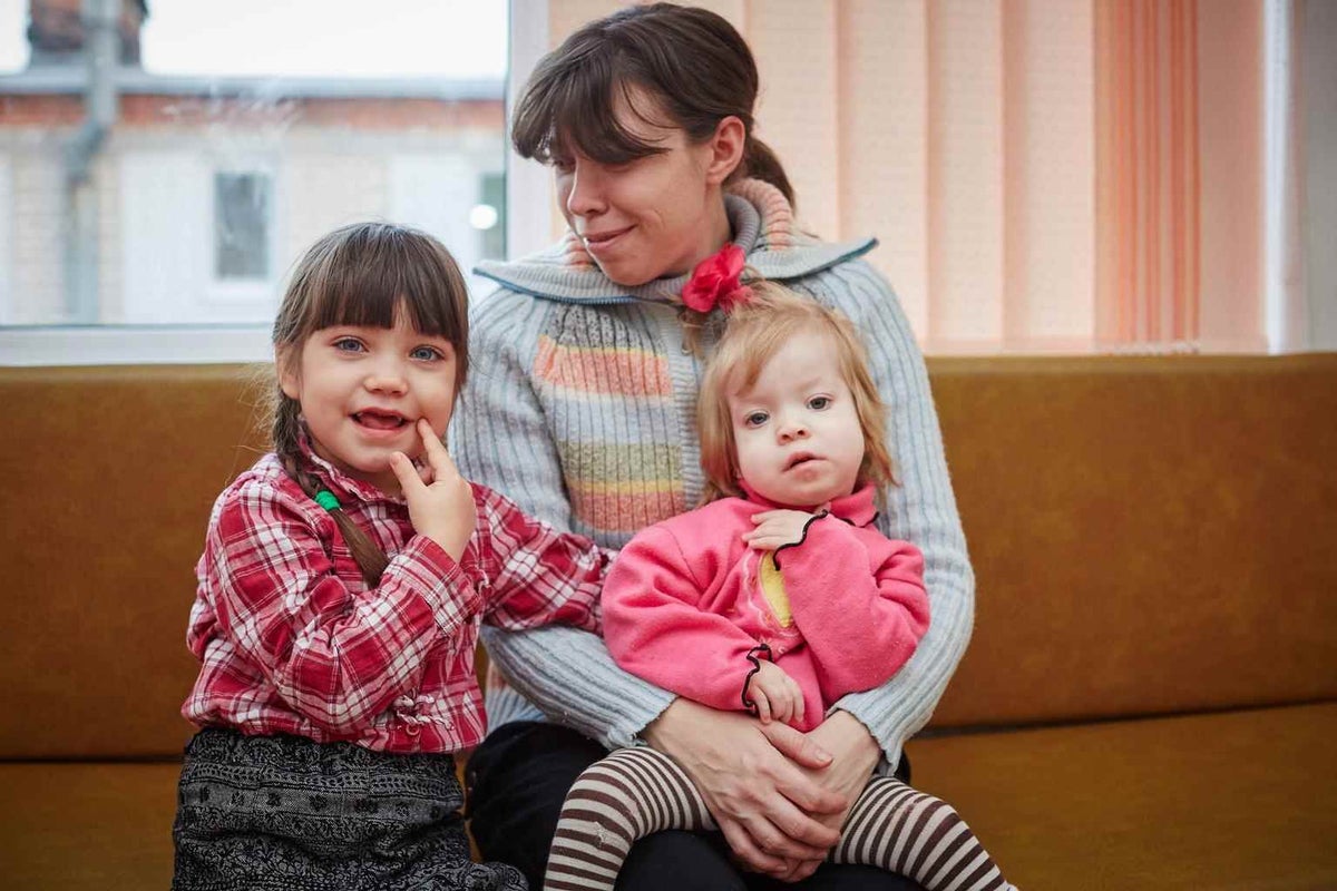 Mariya sits with her daughters in a rehabilitation centre for children with disabilities in Kharkiv, Ukraine in 2014. 